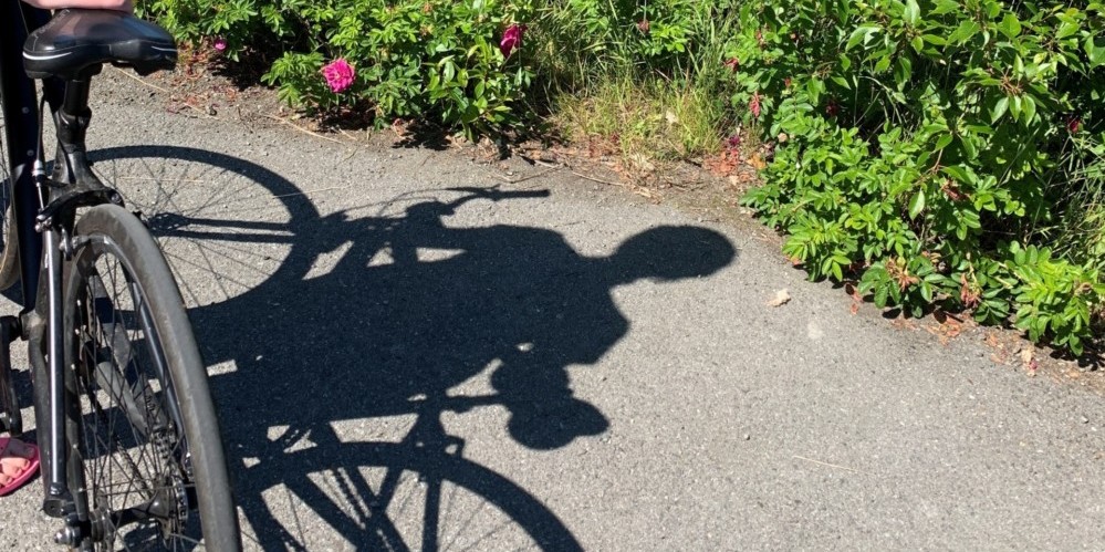 shadow of someone standing by bike